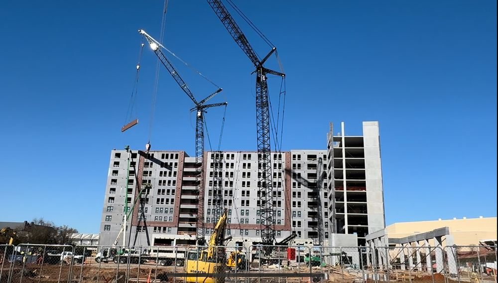 Large multi-story commercial construction project with tower cranes, Columbia, SC