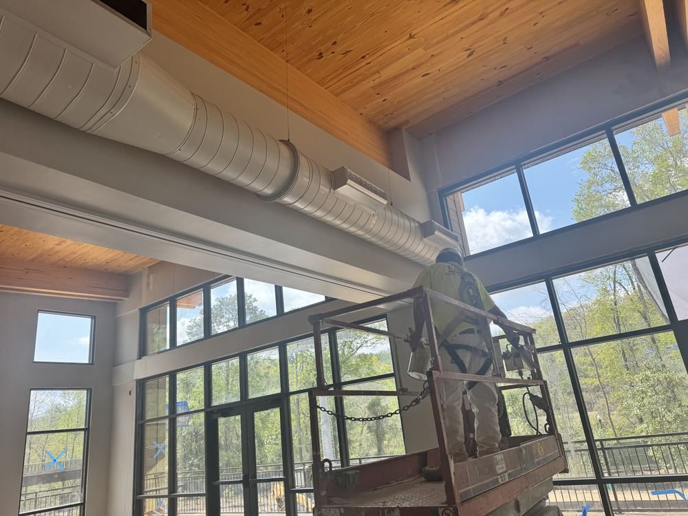 Commercial interior painting from a lift
